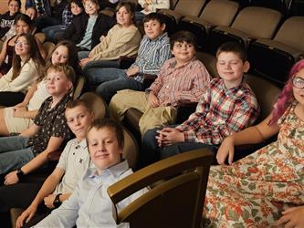 Students watching play